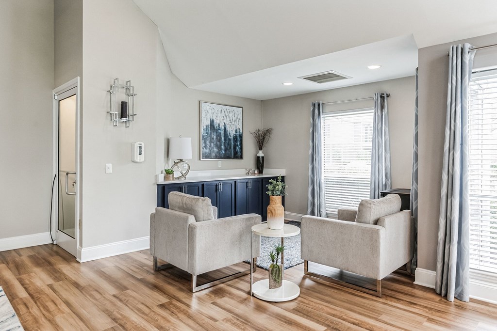 a living room with two couches and a table  at Harrison Grande, North Carolina