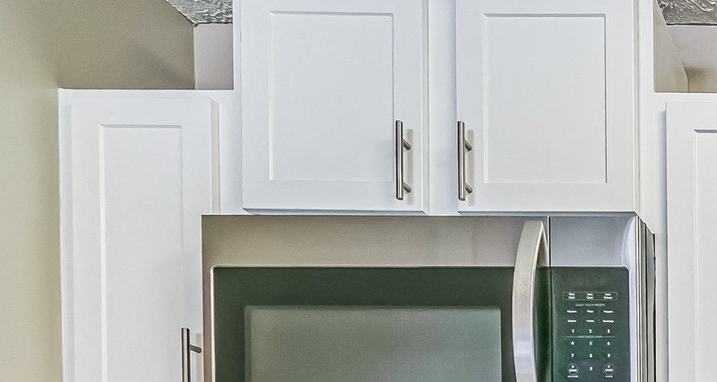 Updated kitchen Updated kitchen with white cabinets and stainless steel appliances at The Atlantic Ashford, Atlanta, Georgia