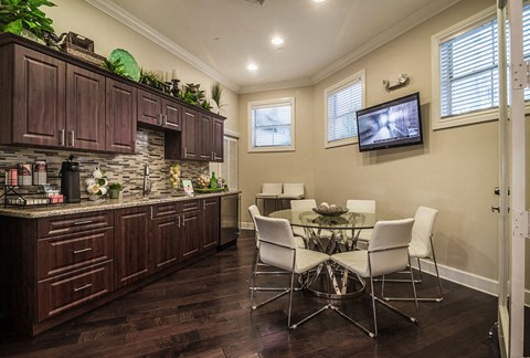 a kitchen and dining room with a table and chairs