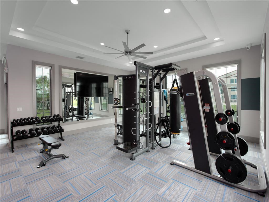 Ultra-Modern 24-Hour Fitness Center with Cardio and Lifting Stations.