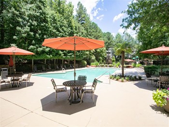 swimming pool with patio furniture
