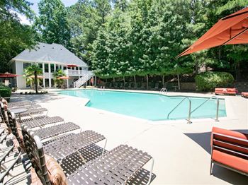swimming pool with patio furniture