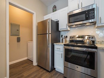 furnished kitchen and appliances in model home