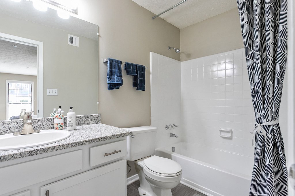 Bathroom with a shower and a sink and a toilet at The Atlantic Briarcliff, Georgia, 30329