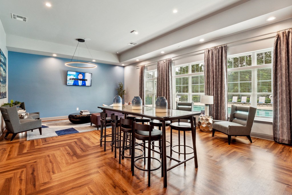 Dining room with a table and chairs in front of a window at The Atlantic Mountain Island, Charlotte, 28216