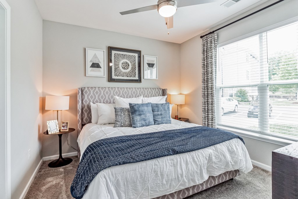 Bedroom with a large bed and a window at The Atlantic Mountain Island, Charlotte, NC, 28216
