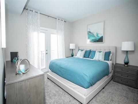 a bedroom with a bed and a dresser
