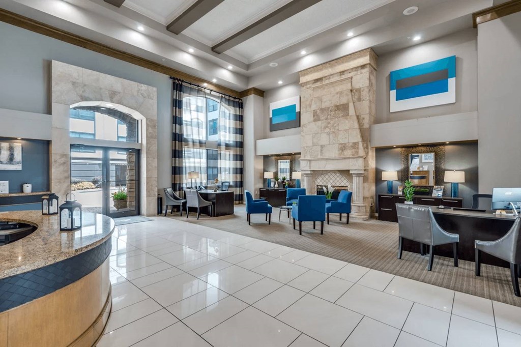 A spacious lobby with a reception desk and seating area. at Montecito Apartments, Houston