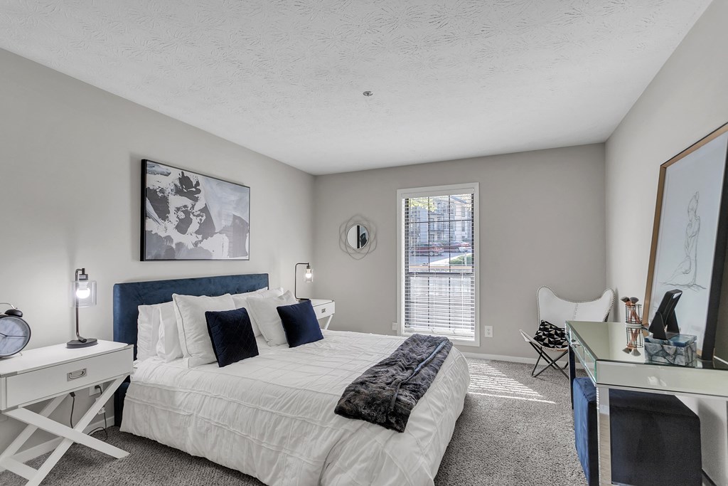 Bedroom with a bed and a desk and a window at The Atlantic Briarcliff, Georgia