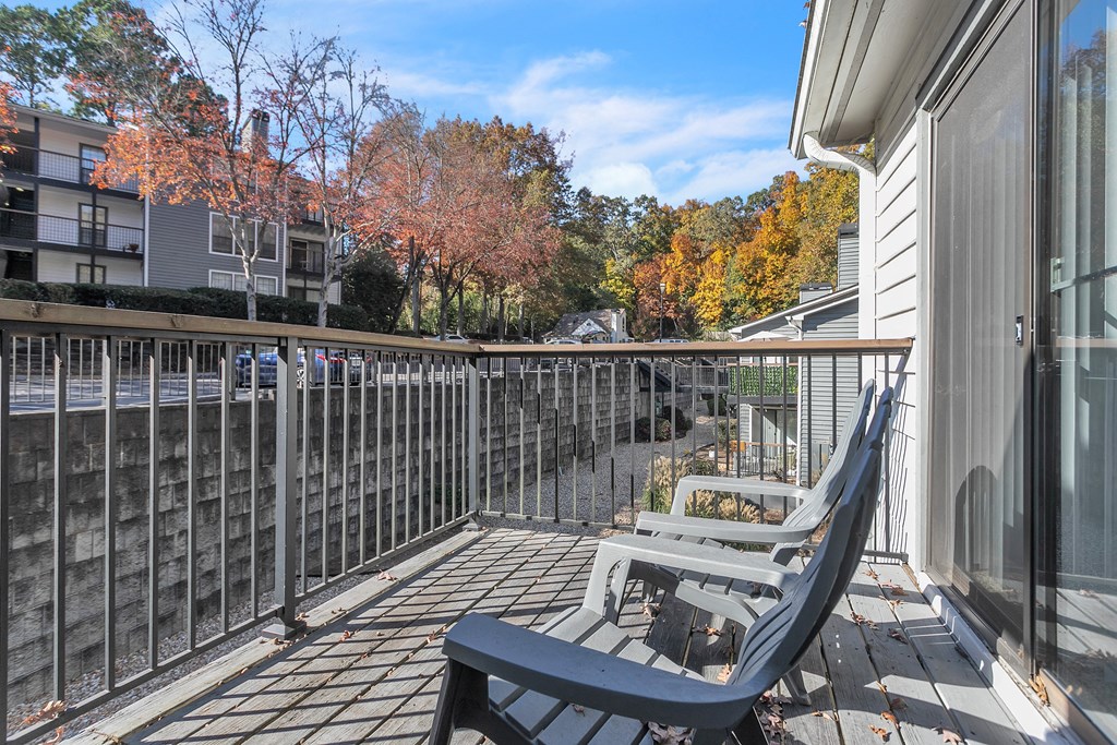 Patio with two chairs and a railing on a balcony at The Atlantic Briarcliff, Atlanta, Georgia