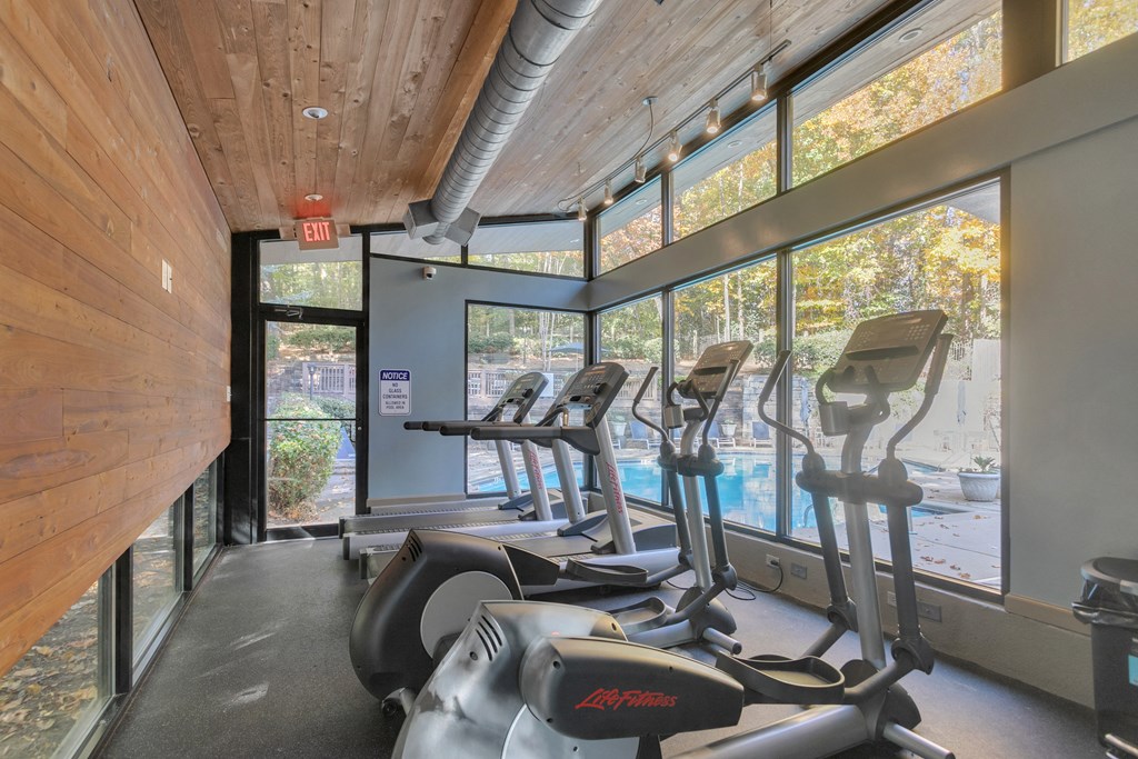 Gym with cardio equipment and views of the pool at The Atlantic Briarcliff, Georgia, 30329