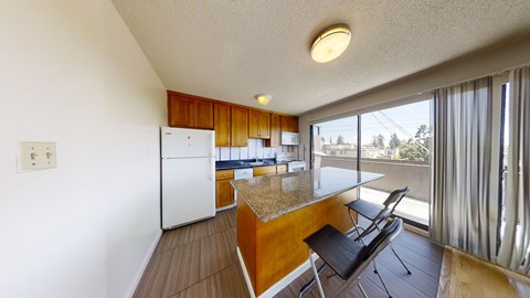 A kitchen with a white refrigerator and wooden cabinets.