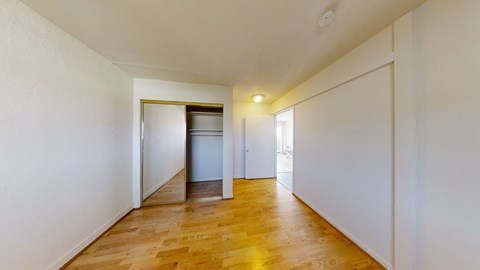 A long hallway with a door at the end.