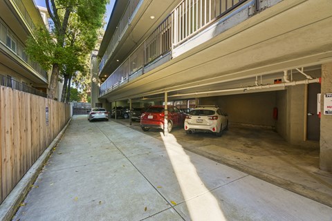 A parking garage with cars parked in it.