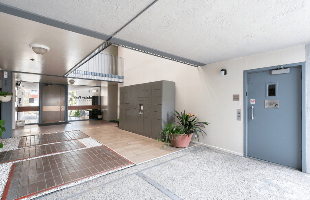 the entrance to a building with a lobby and a blue door