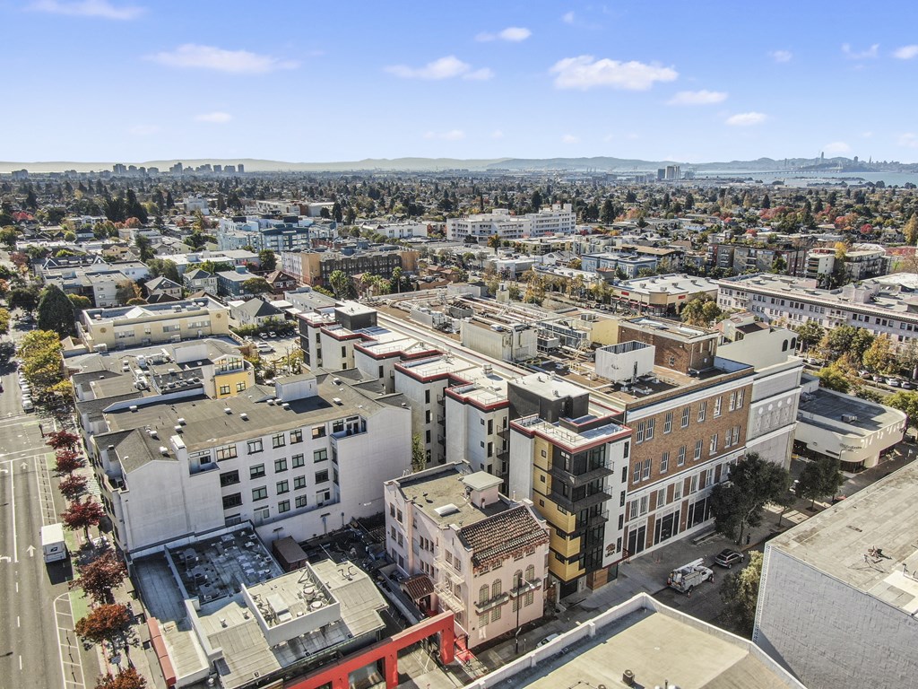 A cityscape with buildings of various designs and colors.
