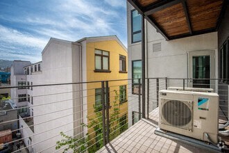 a small balcony with a microwave on it