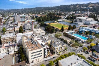 an aerial view of a city with a swimming pool
