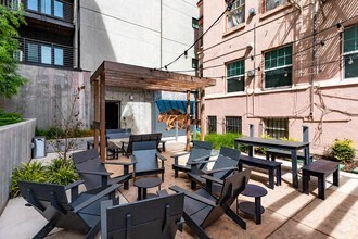 a bunch of chairs that are in front of a building