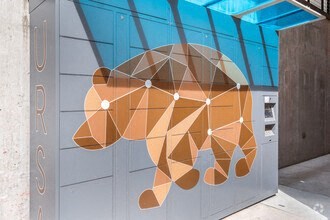 a painting of a bear on the side of a building