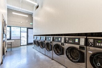 a laundromat with a bunch of machines in it