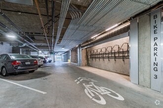 a parking garage with cars parked in it