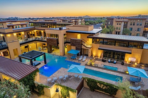 an aerial view of a resort with a swimming pool