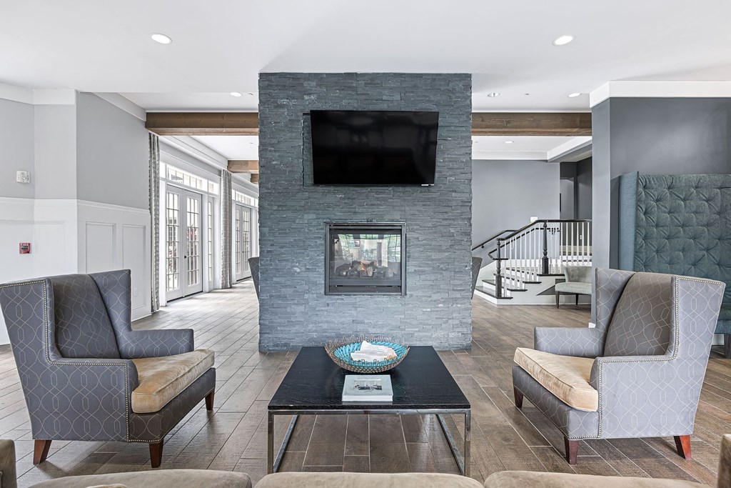 a living room with a fireplace and a television