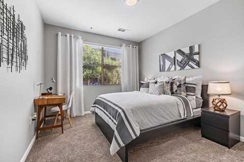 an attic bedroom with a bed and a window