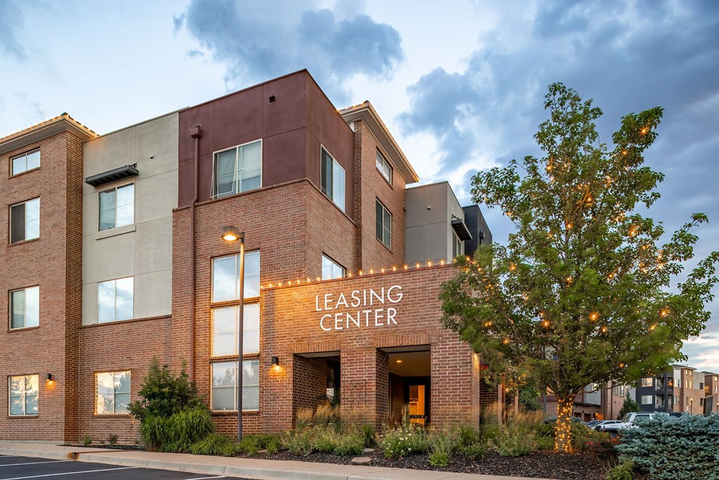 an image of the leasing center building at dusk