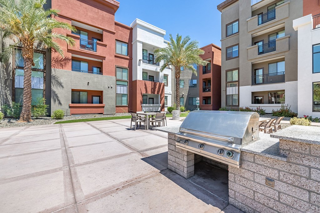 the preserve at ballantyne commons courtyard with a grill and seating area with apartments