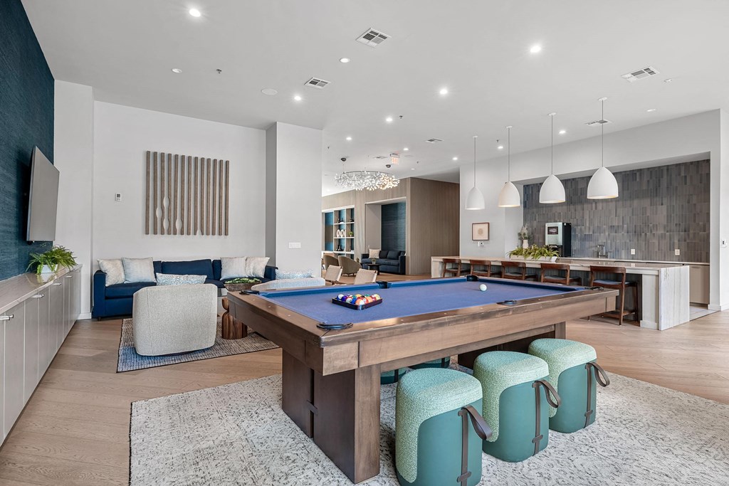a pool table in the center of a living room