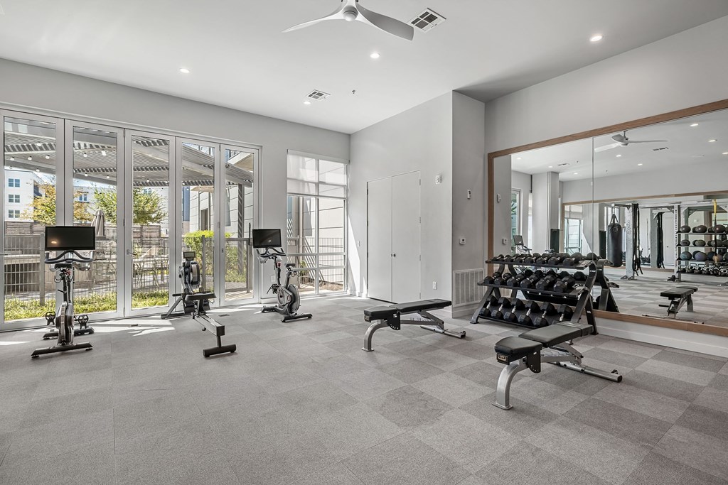the gym is equipped with treadmills and other fitness equipment