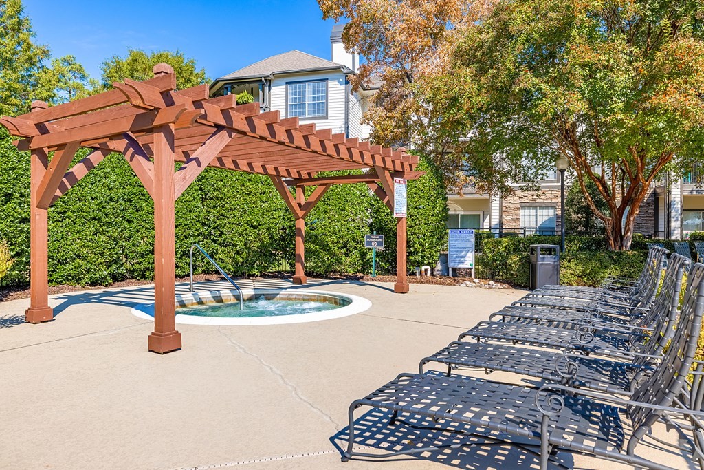 our apartments have a large patio with chairs and a pool