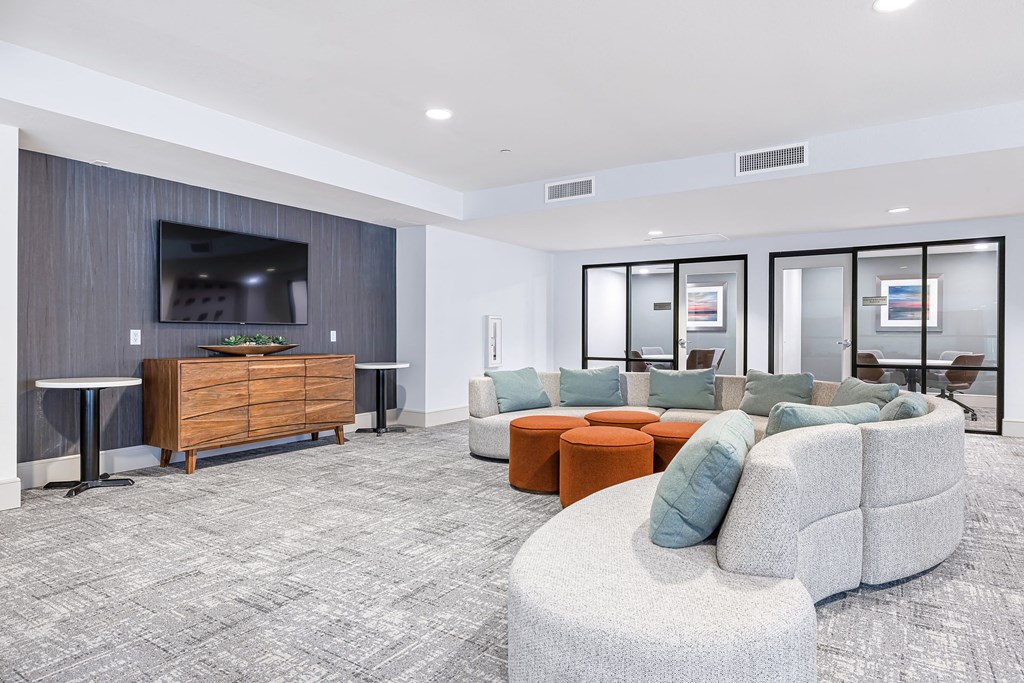 a living room with couches and a tv