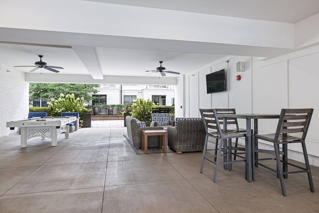 a living room with a table and chairs and a patio