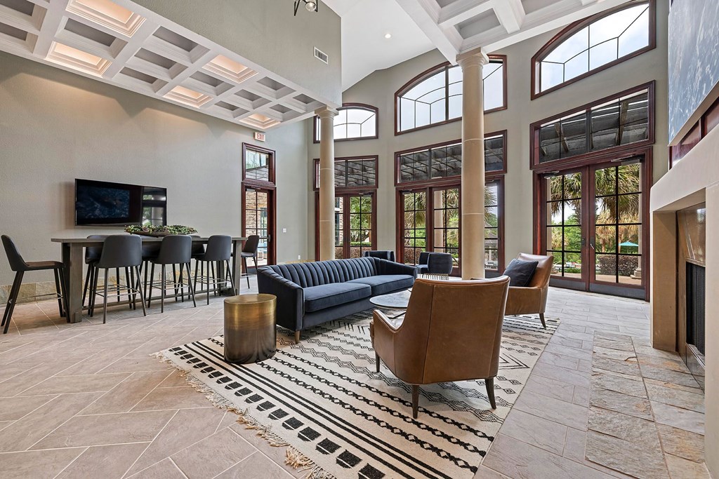 A living room with a blue couch and a television.