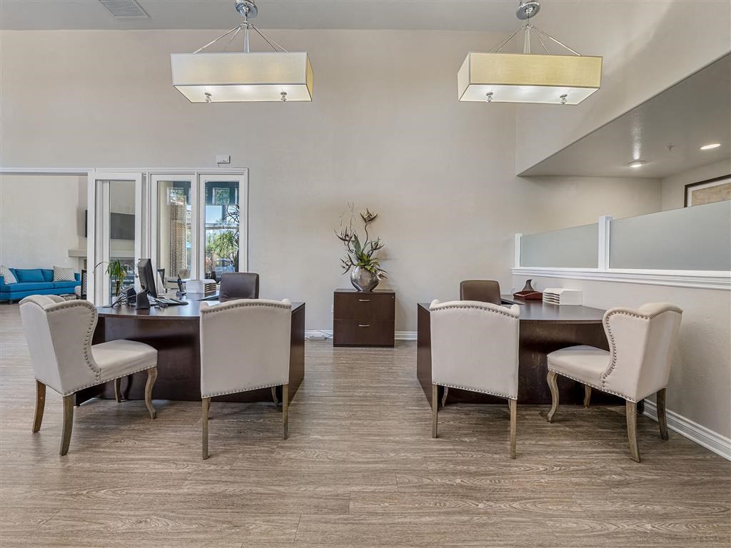 a dining room with a table and chairs