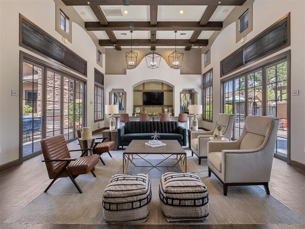a living room with couches and chairs and a fireplace