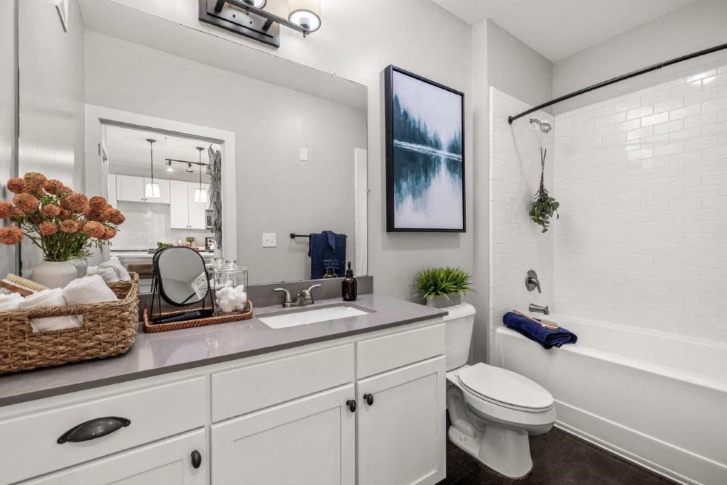 a white bathroom with a sink and a toilet