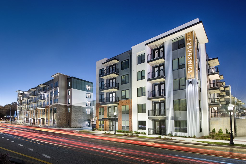 a rendering of an apartment building on a city street