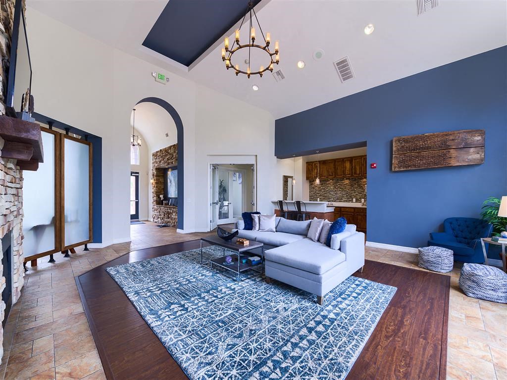 a living room with a couch and a rug