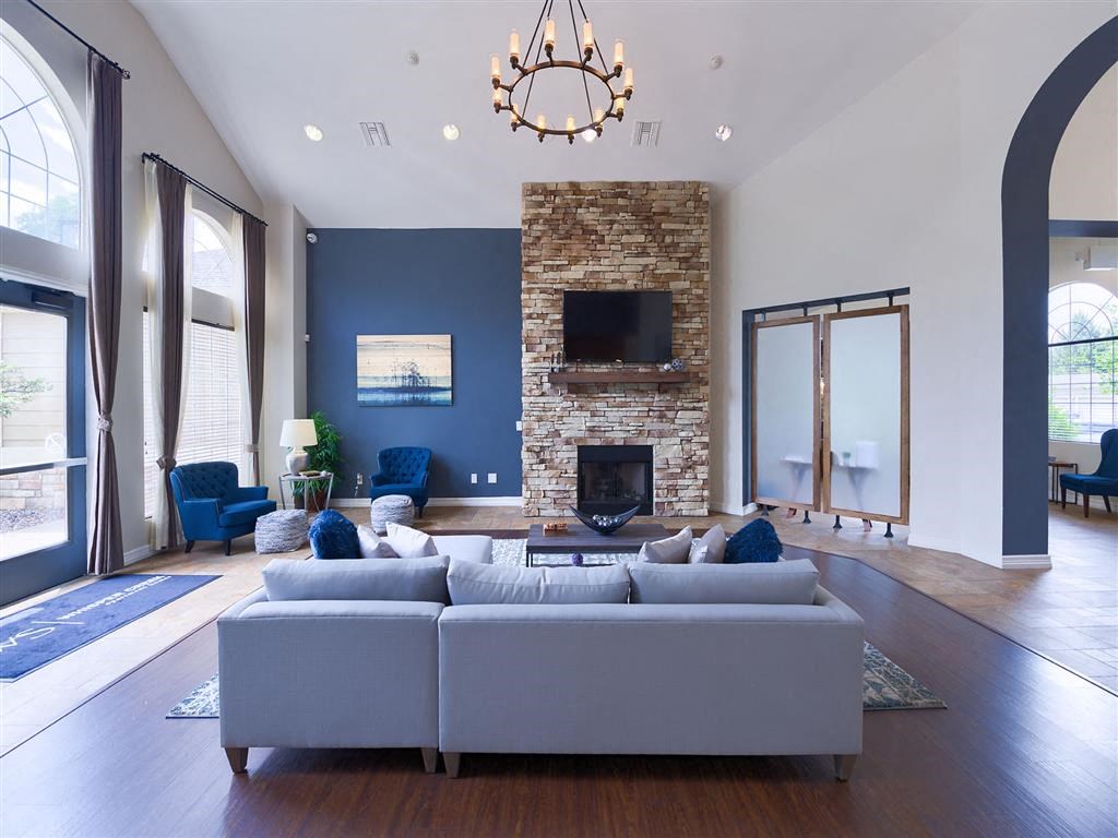 a living room with a couch and a fireplace