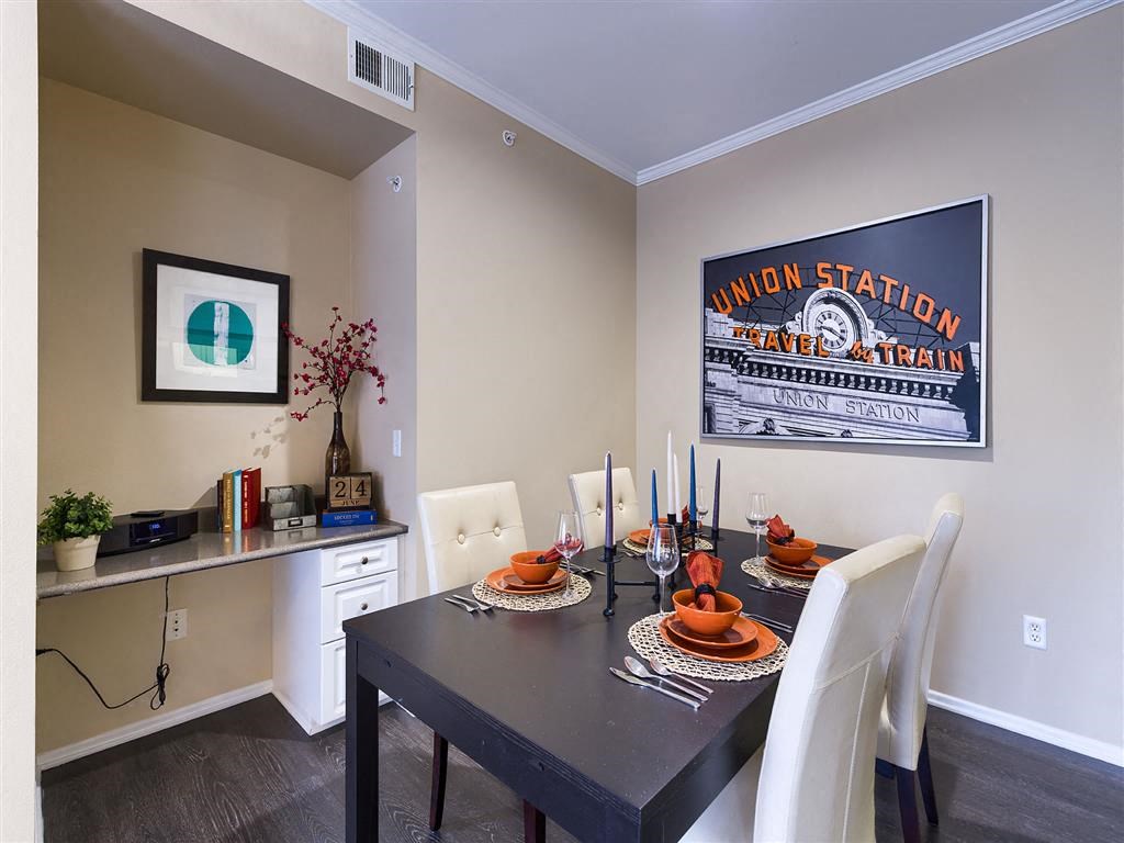 a dining room with a table and chairs