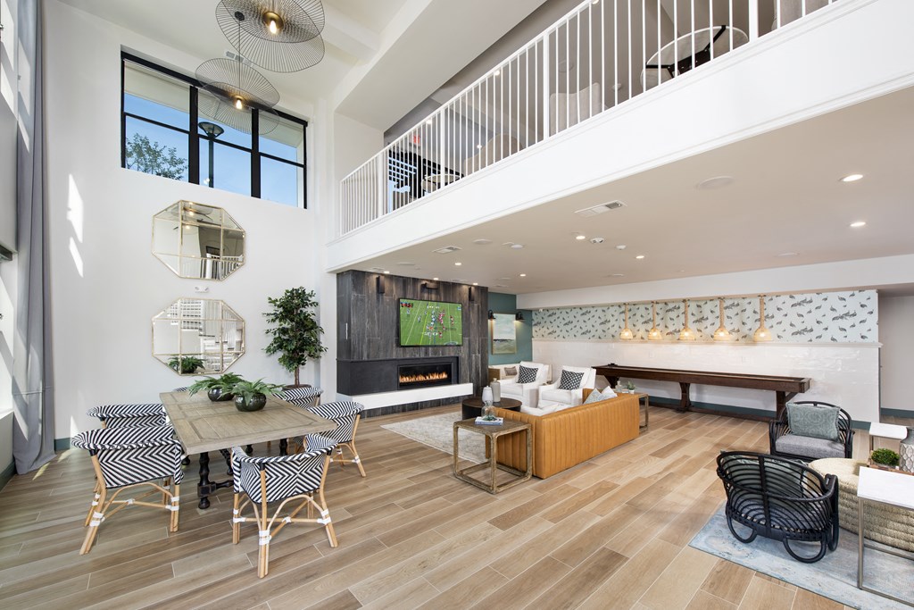 a living room with a couch and a table with chairs