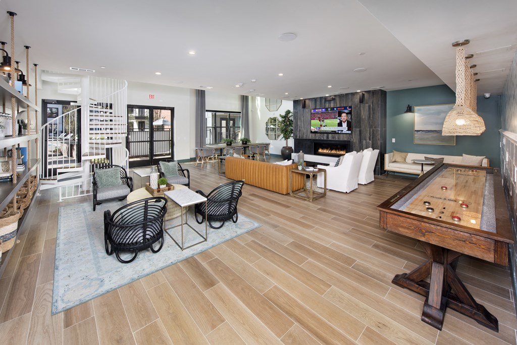 a living room with furniture and a pool table
