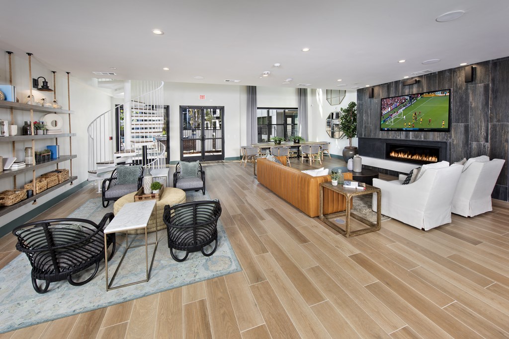 a living room with a fireplace and a television