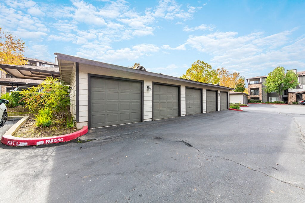a garage with a row of garages on the side of a building