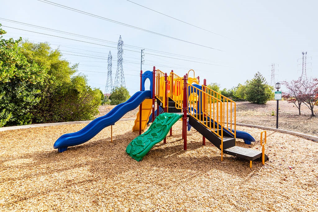 a childrens playground with slides and a? slide