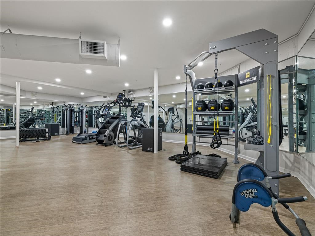 the gym is stocked with weights and cardio equipment at the apartments for rent